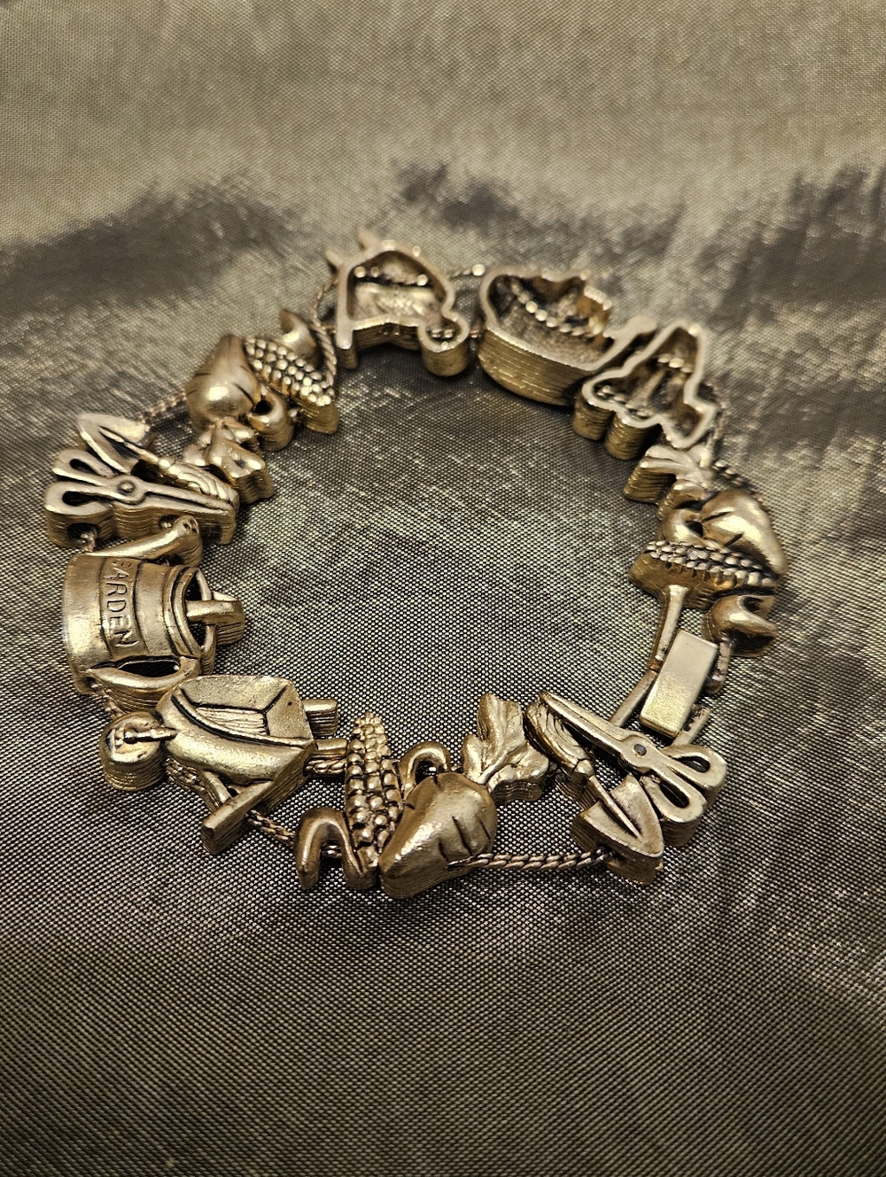 Vintage Garden Charm Bracelet in Antiqued Gold Tone.